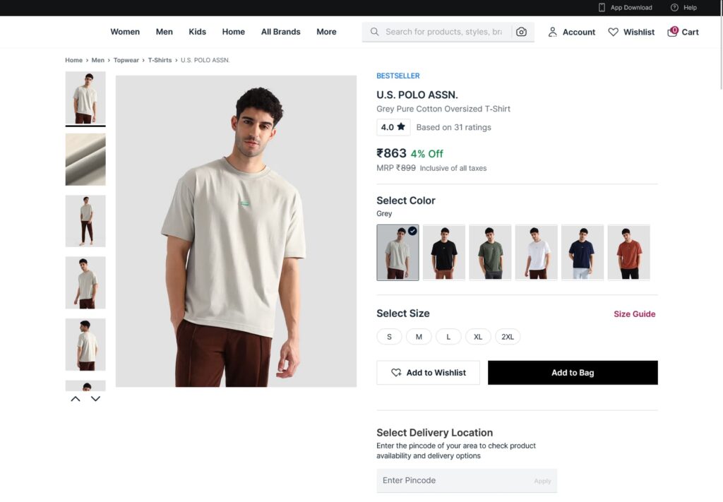 Ecommerce product page for U.S. Polo Assn. grey pure cotton oversized T-shirt showing model image, price ₹863 (4% off), color options, size selection (S–2XL), Add to Bag button, and delivery location pincode field.